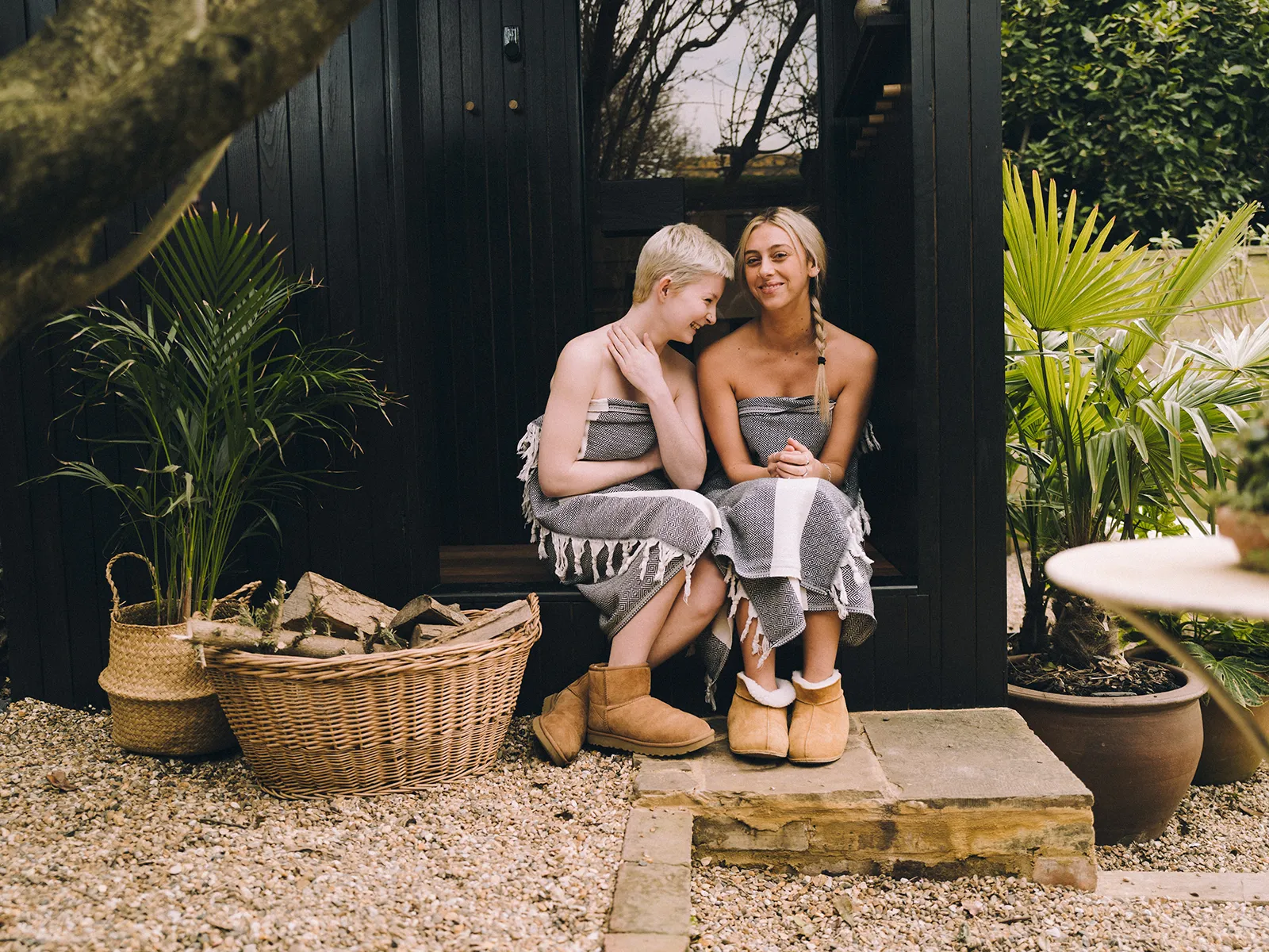 Features Section_Porch_Feature 10 Three Men relaxing outside a Wildhut outdoor Sauna